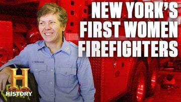 Black and white photograph of Brenda Berkman in early FDNY uniform standing determined outside a firehouse in 1982