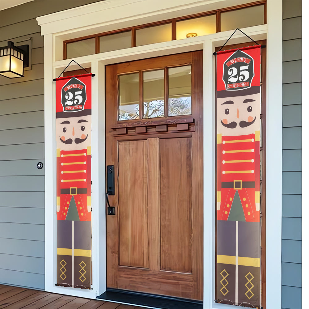 Decorative Christmas nutcracker banners on a door with a wreath.