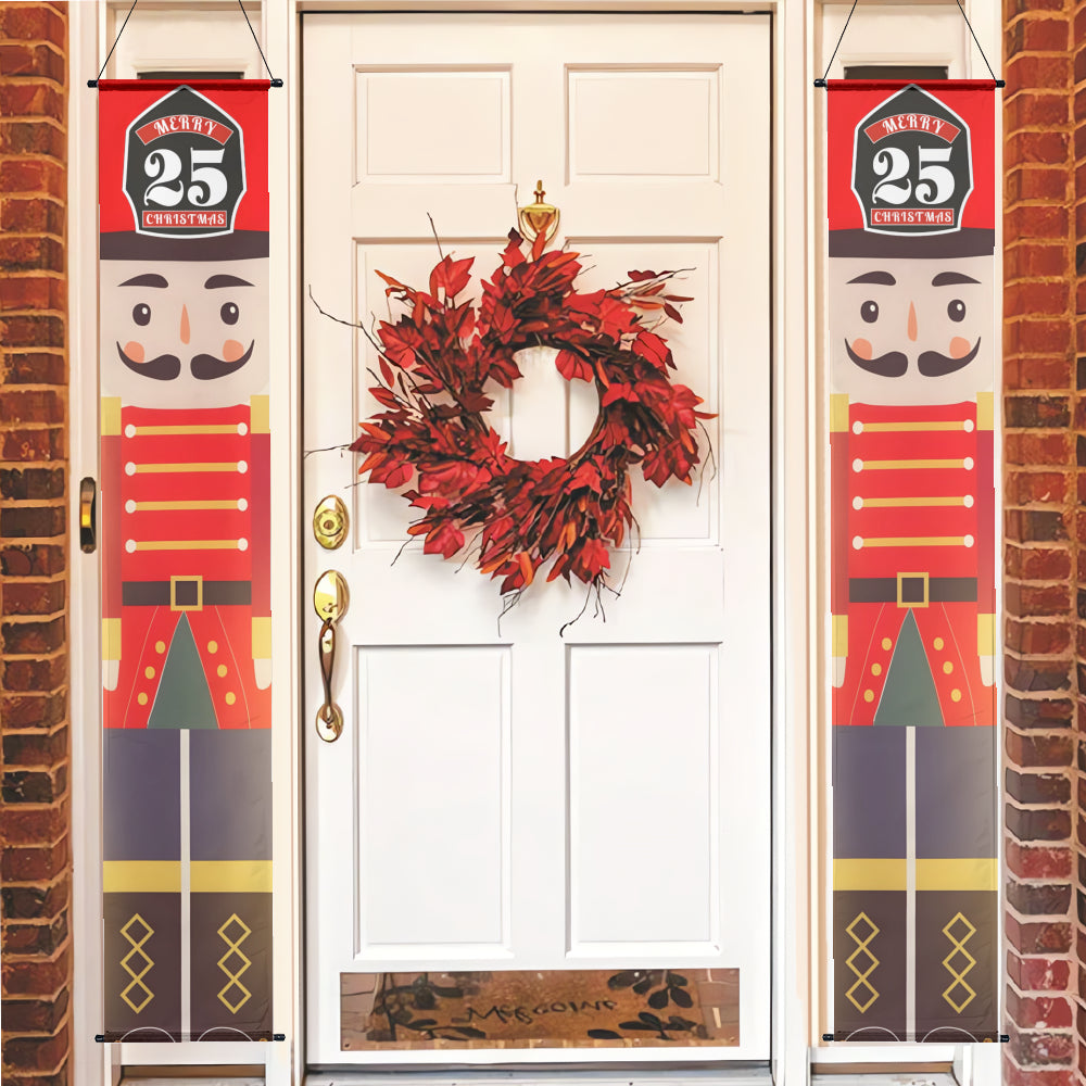 Decorative Christmas nutcracker banners on a door with a wreath.